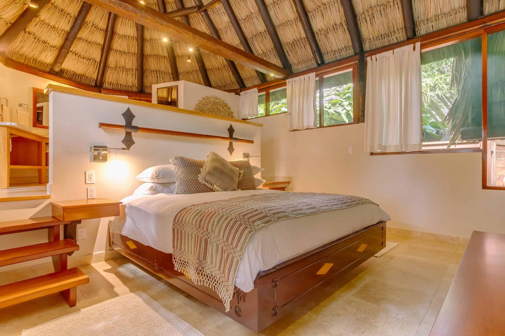chaa creek accommodations tree top villa interior with king bed