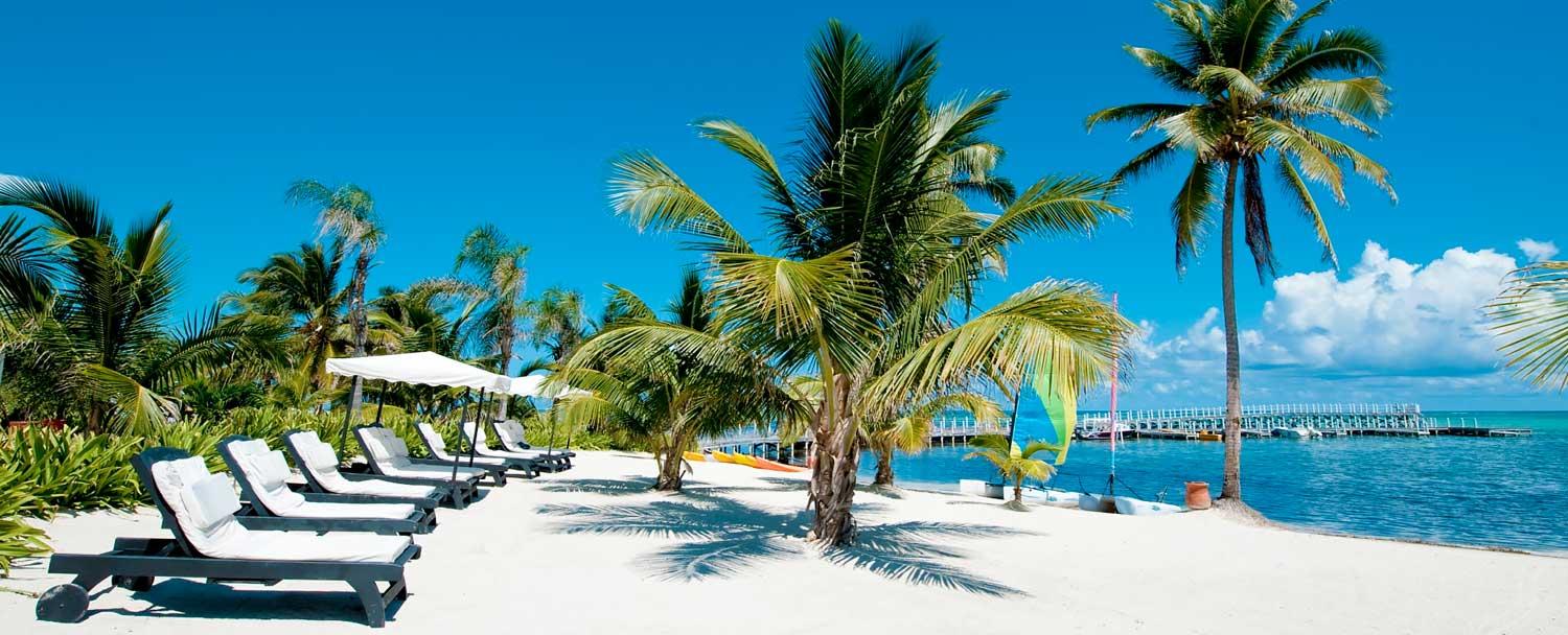 Relax on the beach at Ambergris Caye with Chaa Creek's all inclusive belize vacation package
