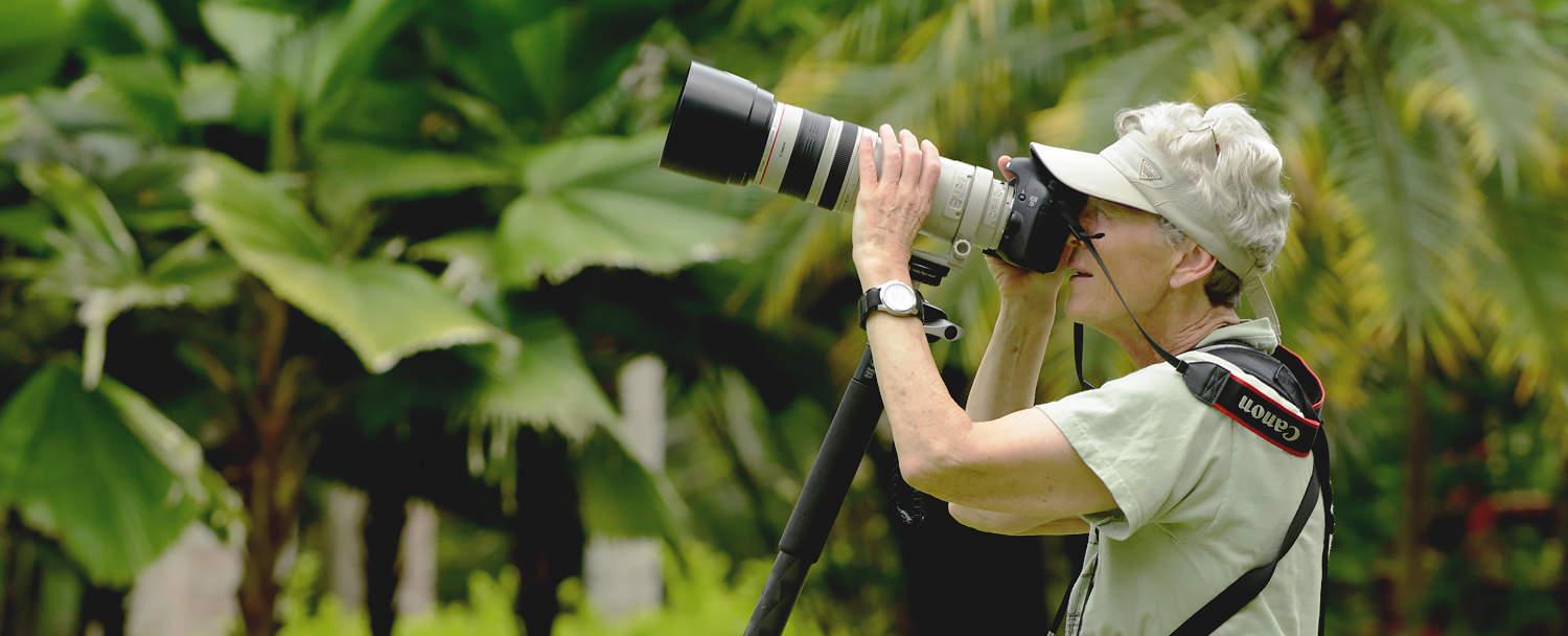 Belize Bird Watching Vacations birder taking photos of birds