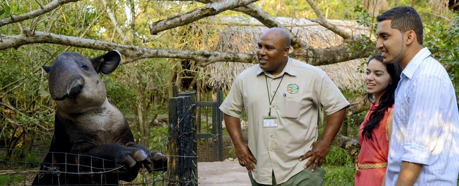 guest visiting belize zoo for christmas vacation with a chaa creek guide