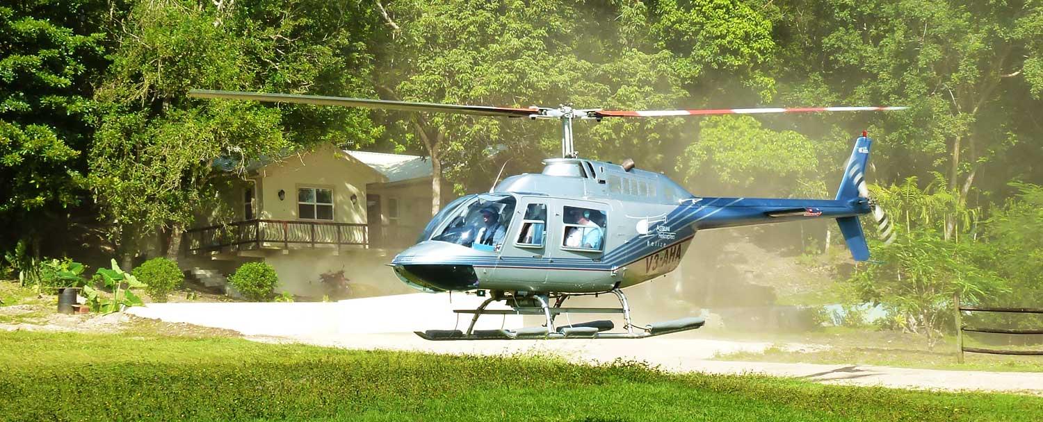 Helicopter landing at Chaa Creek's Belize Heli Pad