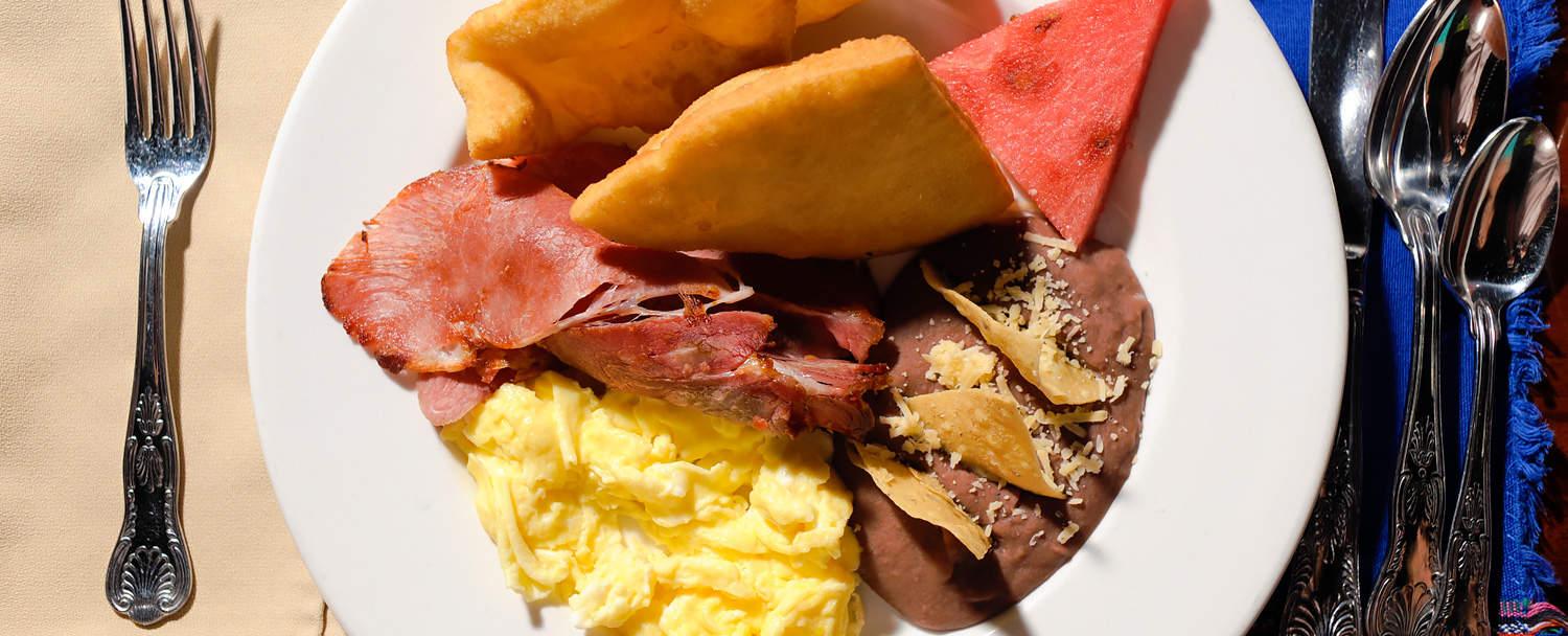 belizean breakfast eggs beans and fry jacks at belize resort