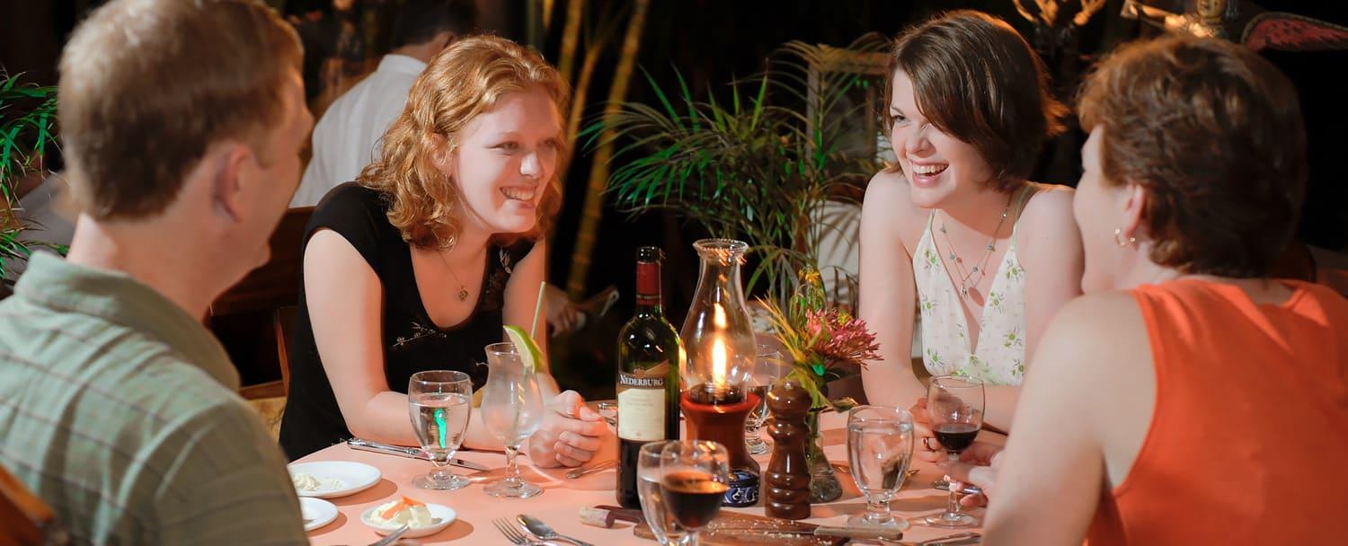 family dining with wine at chaa creek belize jungle resort