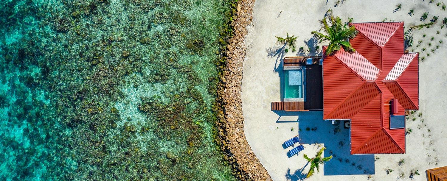Aerial photo of Ray Caye island resort accommodation with private pool