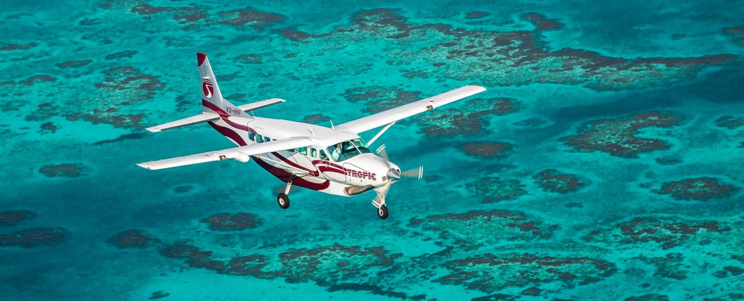 traveling to belize tropic air flying over belize barrier reef