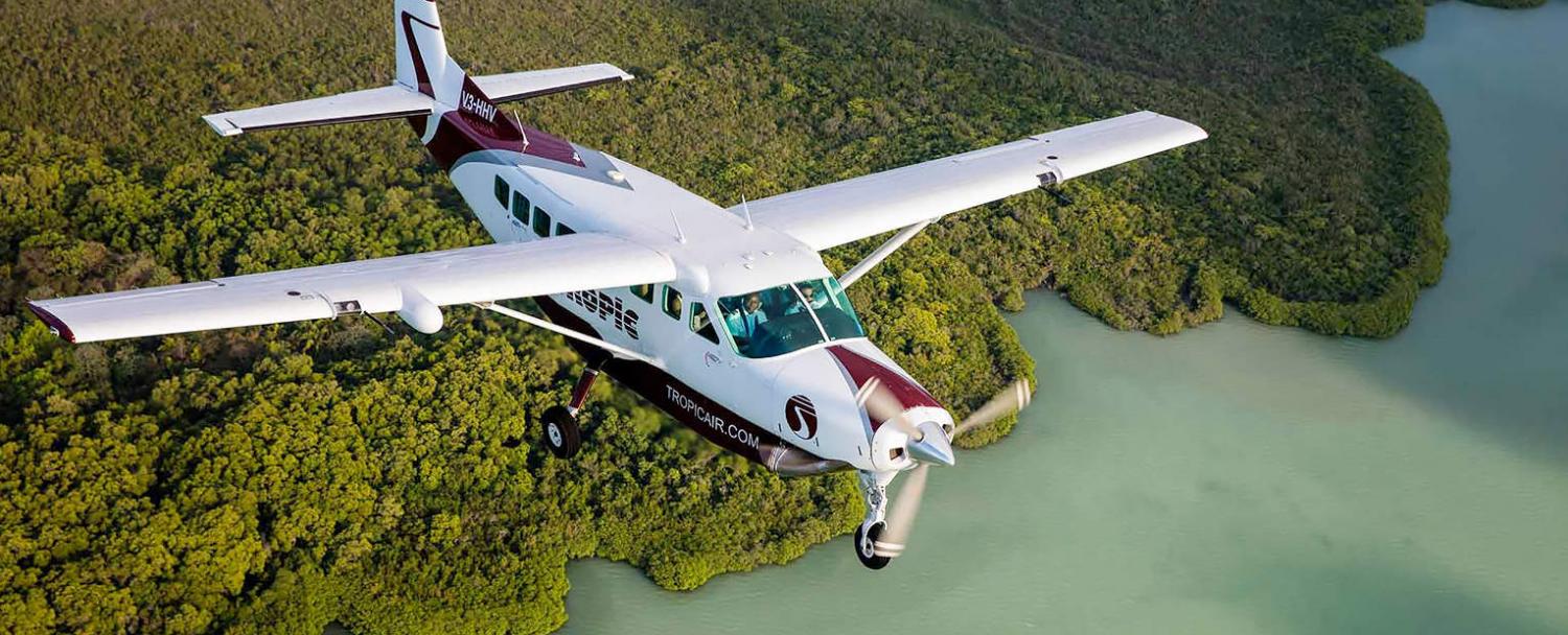 traveling to belize tropic air flying over swamp and mangroves